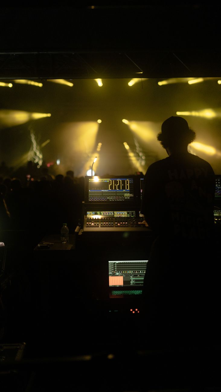 Dynamic night club scene in Istanbul featuring a DJ at the mixer with vibrant lights and an energetic crowd.